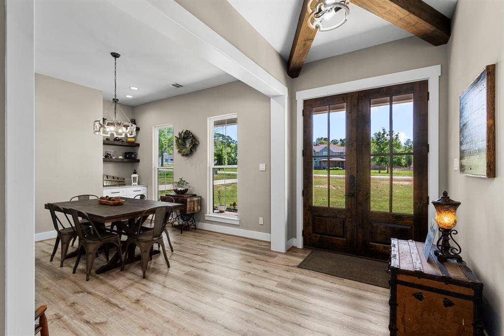 Very grand opening into your formal dining area. This space host ample space for an even larger dining table. Complimented with a built in china area that could potentially be used for a bar area.