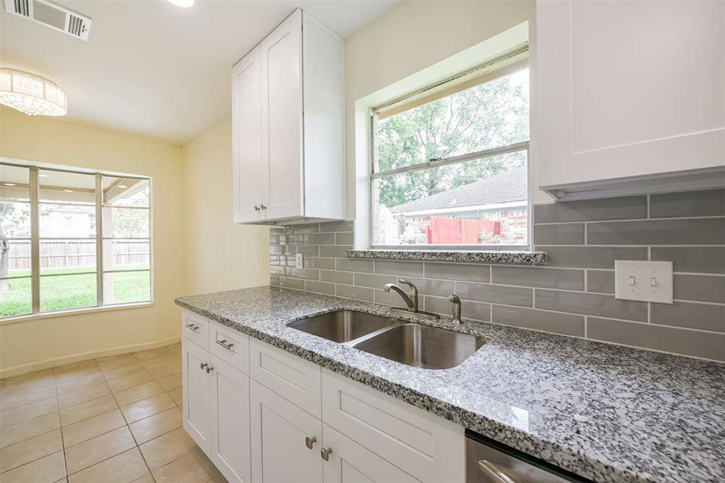 Large kitchen window lets in lots of light.