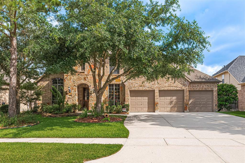 A extended driveway offering plenty of parking for guests and family alike.