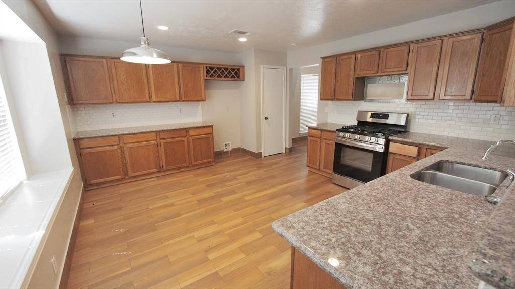 Oversized Kitchen with Stainless Steel Appliances
