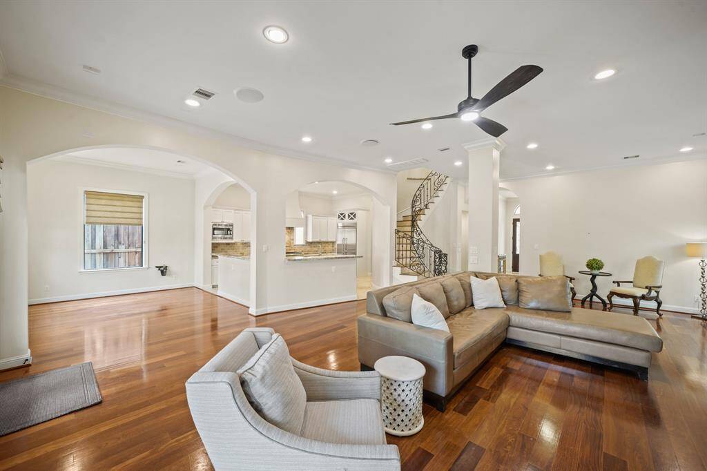 A view of the den, breakfast room, kitchen & foyer from the back of the living room. This space has anatural flow and is great for entertaining!