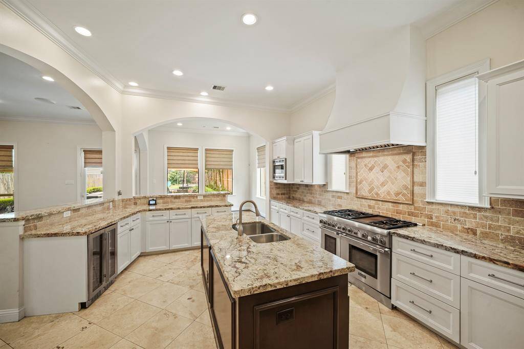 Thoughtfully planned, this kitchen offers an abundance of counter, cabinet & drawer storage along with pots & pans drawers, a "lazy susan" storage area and large walk-in pantry.