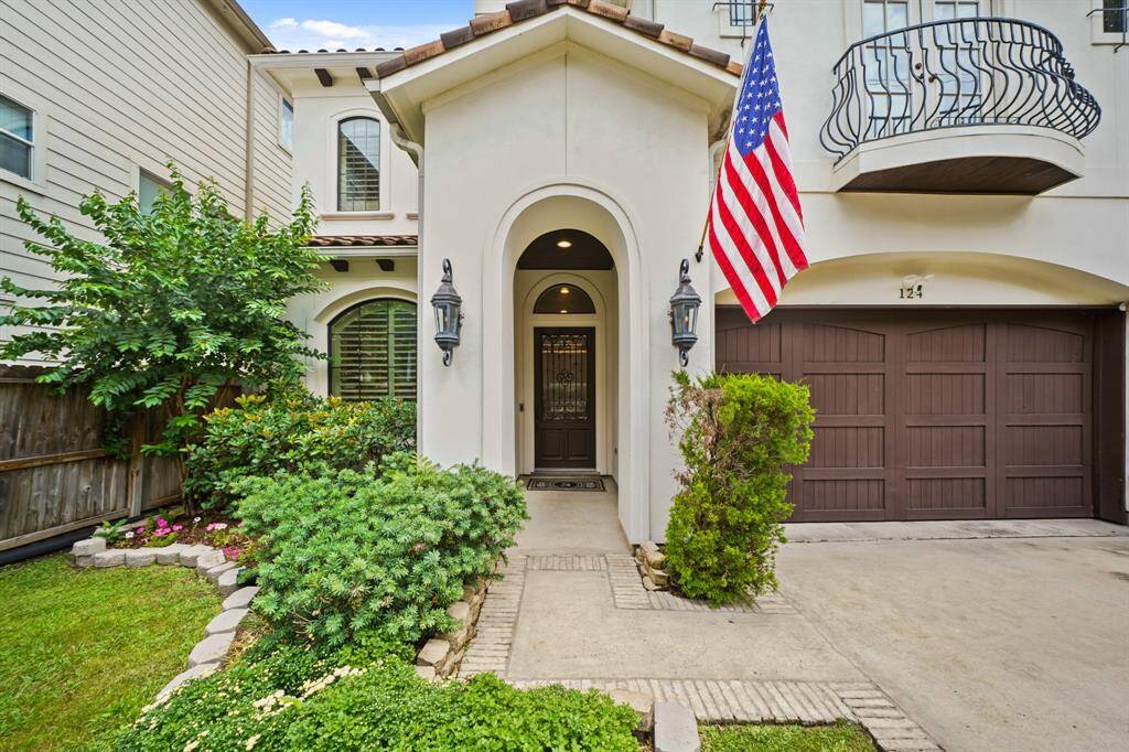 The exterior of the home features a stucco exterior accented by wood-stained corbels, decorative wrought iron accents, arched windows, a balcony off the second floor and a tiled roof. The brick-lined, double-wide driveway provides additional off-street parking and leads to the home's two car attached garage. Included is an exterior camera surveillance system.