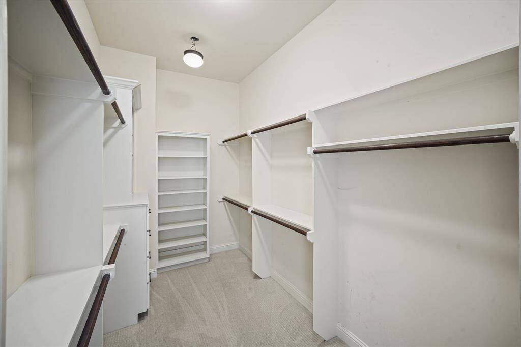 Included are two walk-in wardrobe closets with double-hung wardrobe storage rods & plenty of built-in shelf storage.
