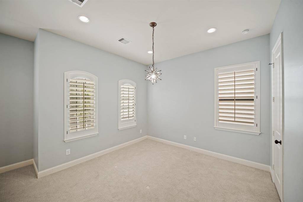 The third bedroom features beautiful carpet, pendant & recessed lighting, windows with plantation shutters, a walk-in wardrobe closet and access to the shared second bathroom.