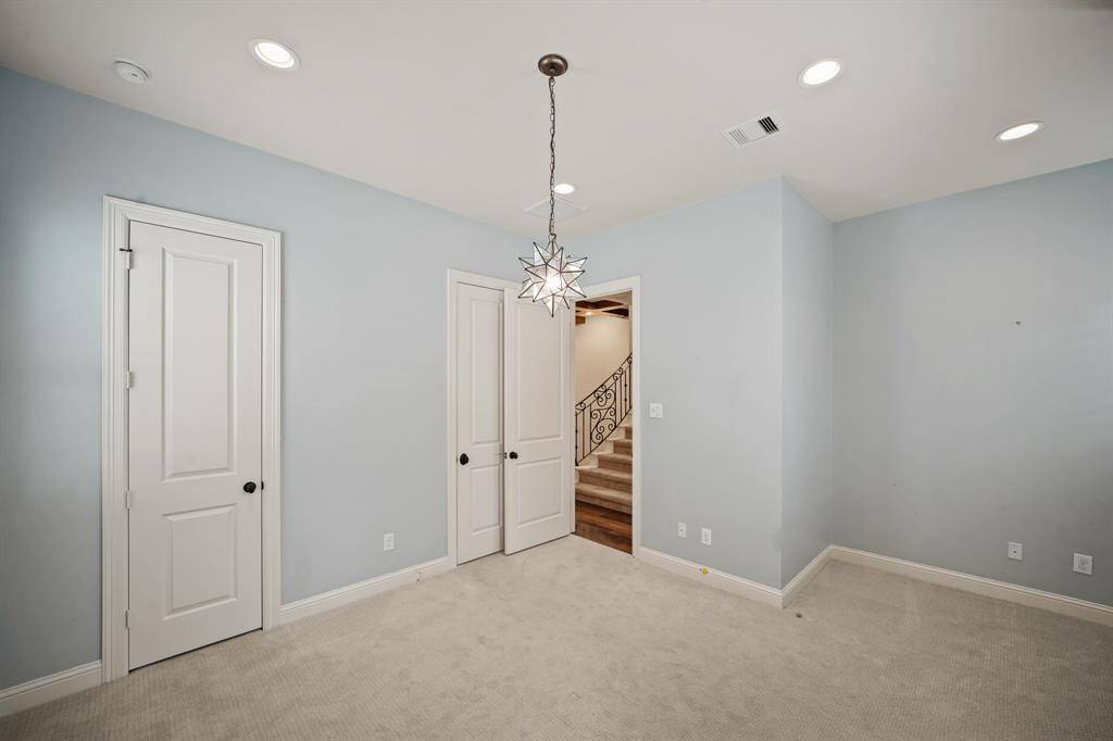 Included is a study nook or play area complete with recessed lighting and an arched window with plantation shutters.