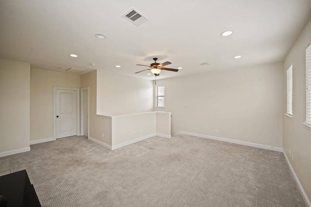 Another view of the game room with the private bath and storage closet in the background.