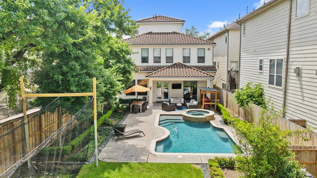 Enjoy this backyard oasis and retreat in the heart of Houston complete with a heated saltwater swimming pool, elevated hot tub with cascading waterfalls surrounded by beautiful patterned concrete decking and professional landscaping. All outdoor furniture along with the "Egg" barbecue grill remains with the home. The batting cage is removable if not wanted and weekly pool maintenance is included.