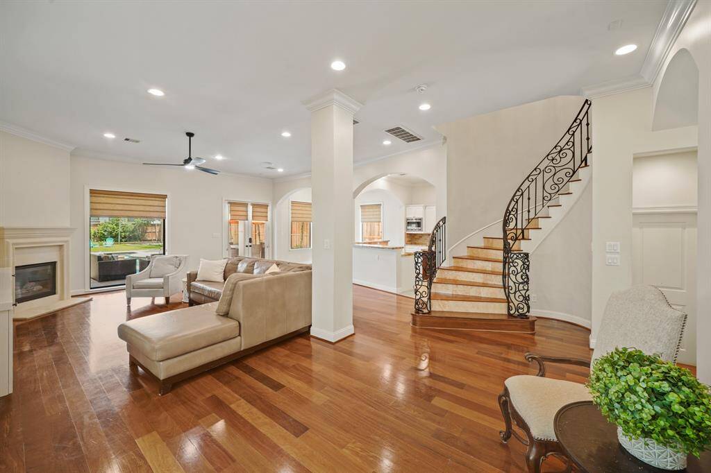 A view of the family room, kitchen & staircase from the formal living room.