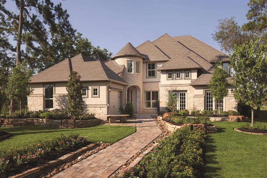 With a commanding exterior of stone and brick, 14822 Vista Chase Trail offers the perfect blend of classic design and modern luxury.