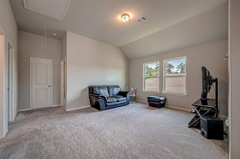 Upstairs, a large, versatile game room awaits, offering endless possibilities for recreation and leisure.