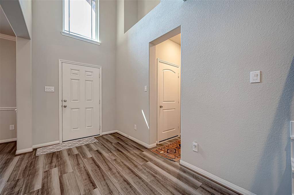 As you step into the foyer, you're greeted by the inviting ambiance that permeates every corner of this residence.