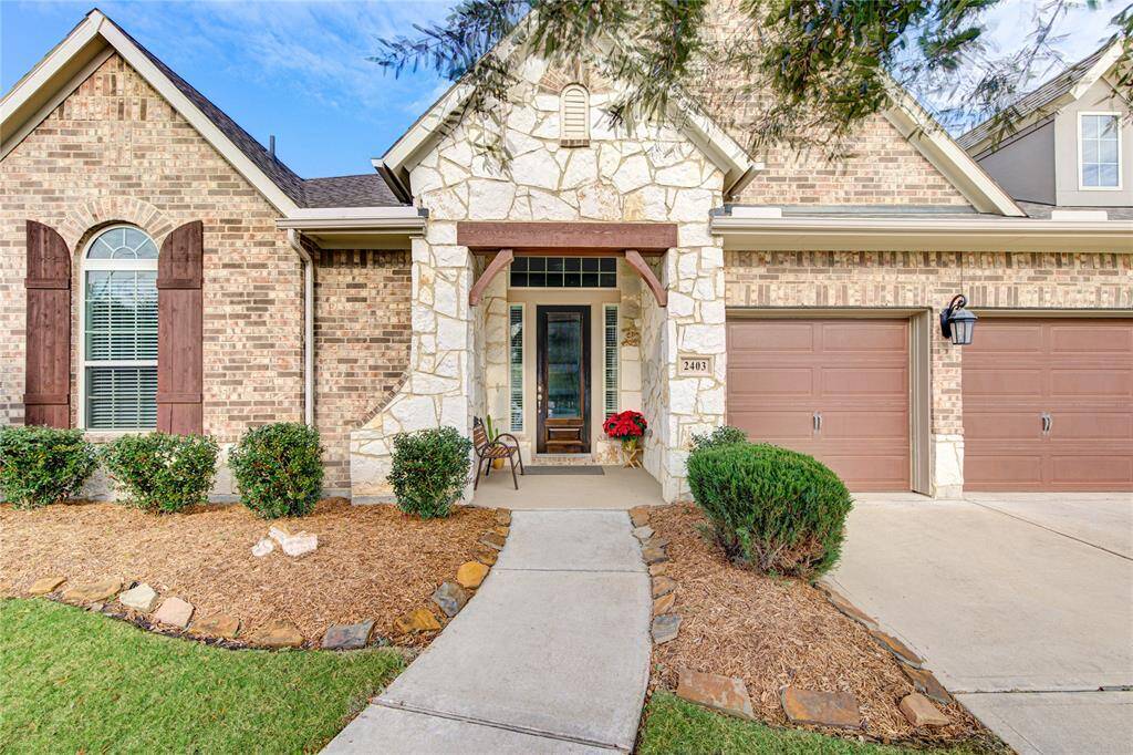 Gorgeous curb appeal along with the brick and stone exterior at this corner lot home!