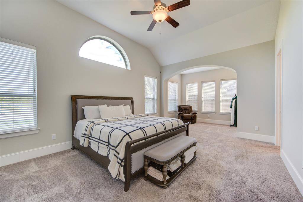 Primary bedroom with high ceilings