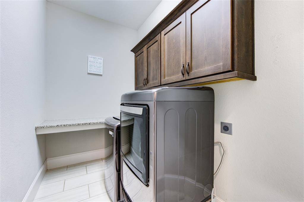 Laundry room with cabinest display