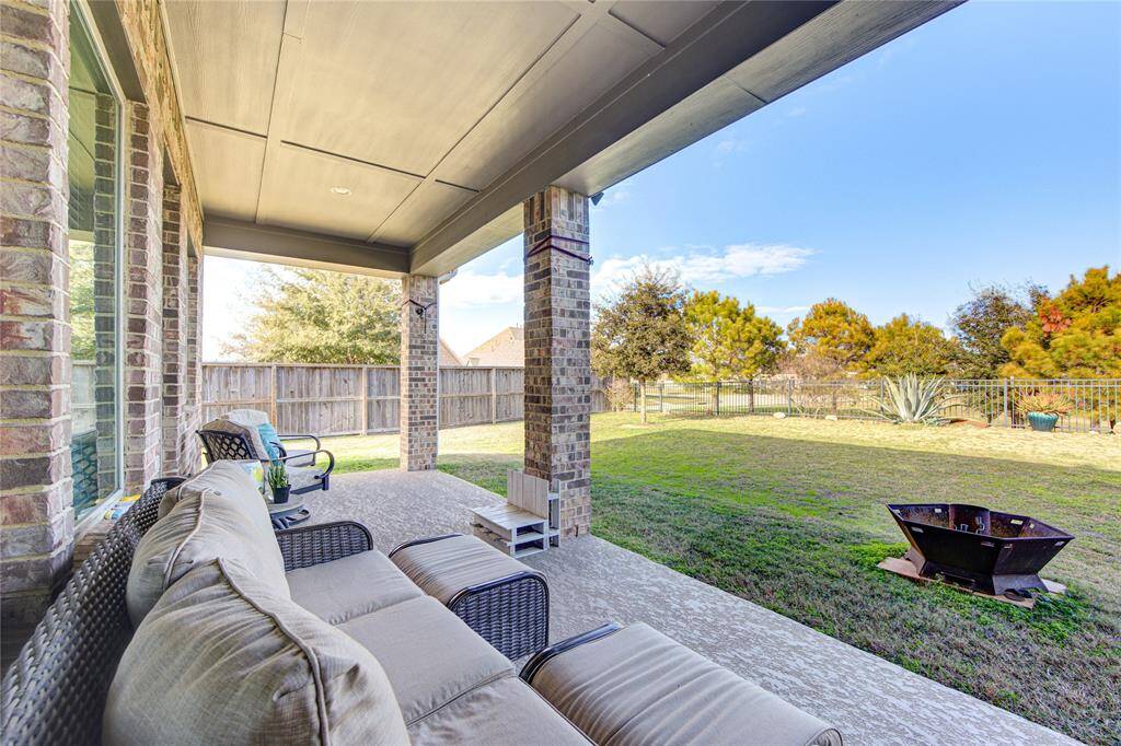 Covered back porch for the gorgeous evenings or morning coffee