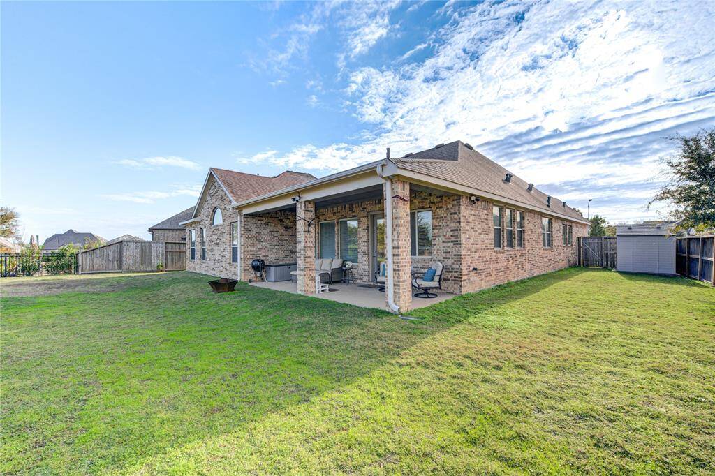 This spacious backyard offers unlimited options for outdoor games, and great for pets