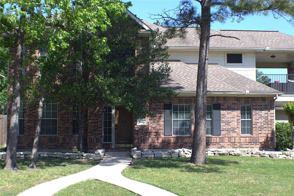 Situated on a spacious corner lot with no back neighbors, this stunning two-story home offers curb appeal and modern convenience. The classic brick exterior is complemented by mature trees and a well-manicured lawn, effortlessly maintained with an automatic sprinkler system. Enjoy peaceful mornings or evening sunsets from the covered front porch or second-story balcony. With a three-car garage and a prime location in a desirable neighborhood, this home is a perfect blend of comfort and style!