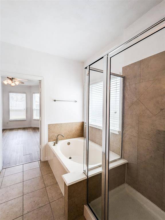Master bath has separate shower and bath