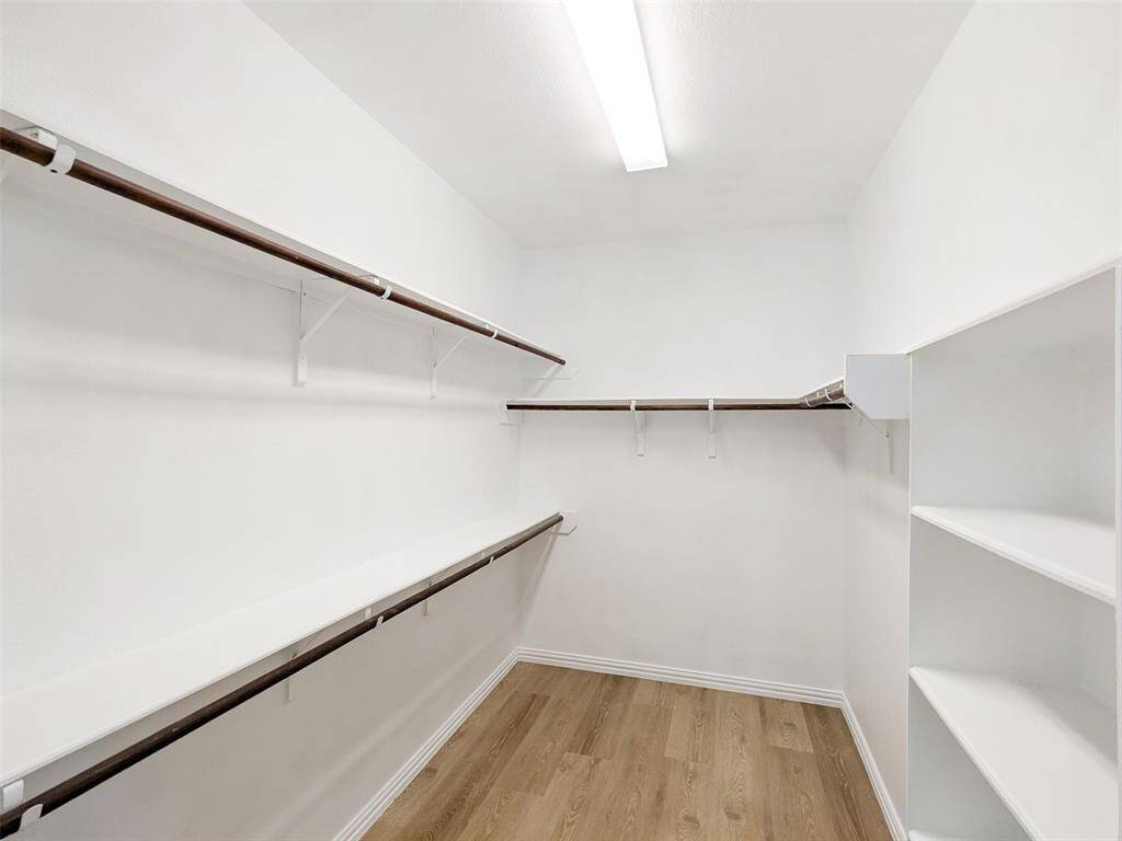 Walk-in closet with towel/shoe shelves