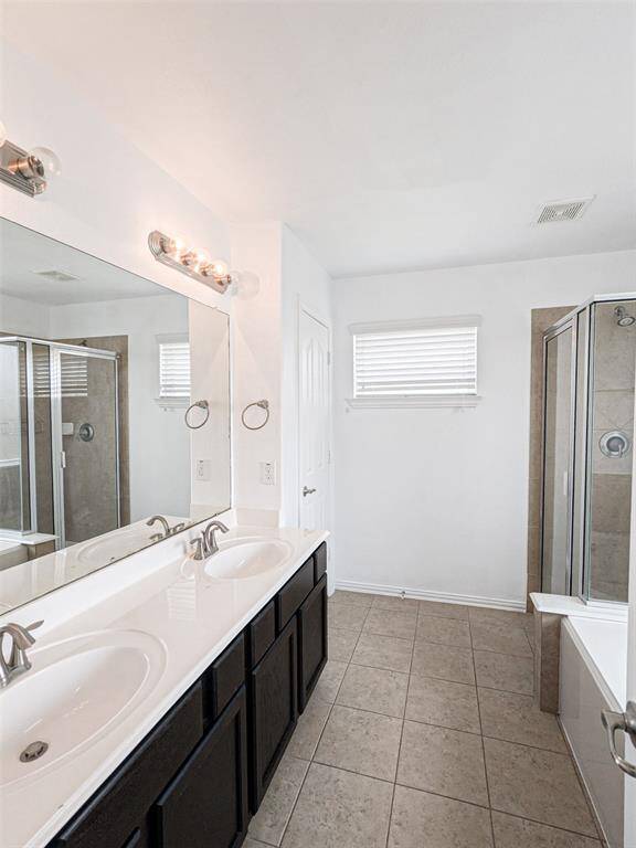 The second master bath suite has a separate shower and bath and double sinks