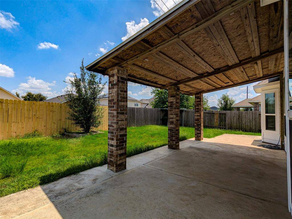 Extended covered patio at the back of the house