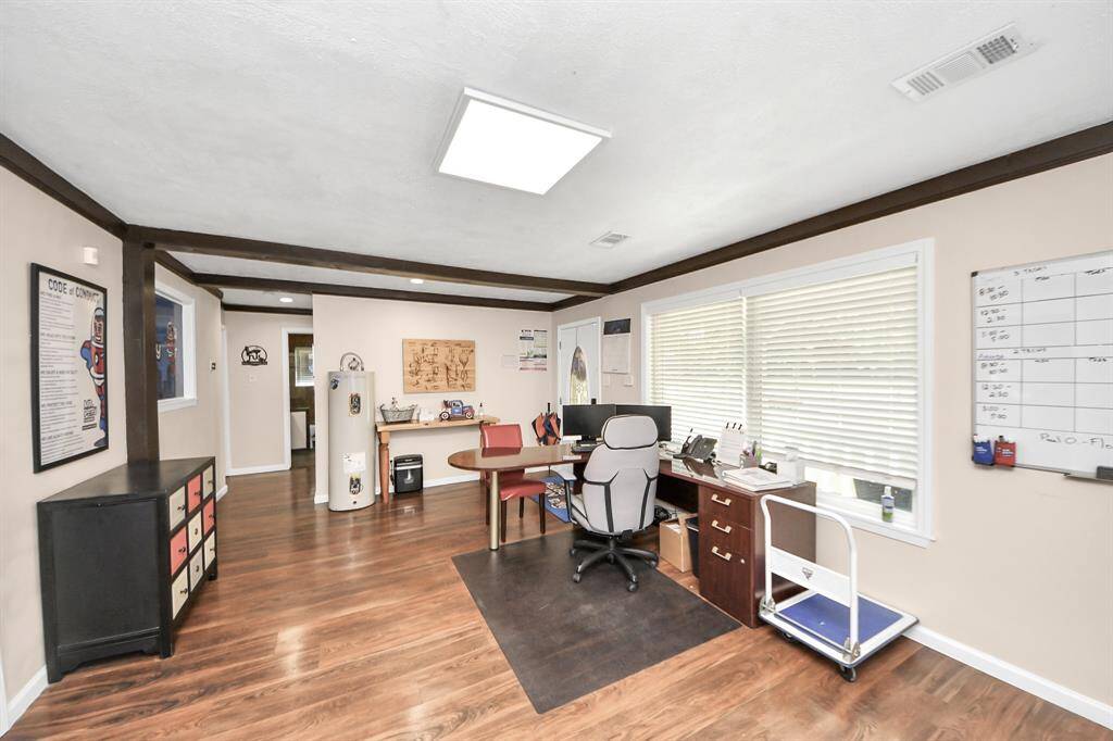 This is the floor plan to give you a better idea of how it could be used both commercially and residentially.  The two small offices on the left were originally 1 bedroom.  A small wall was added and could easily be removed to convert it back into a bedroom.