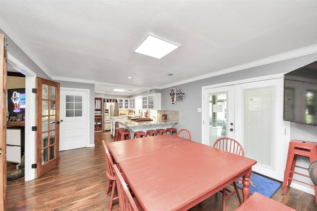 The cabinetry to the left is a coffee bar, and the pantry has pull out drawers.