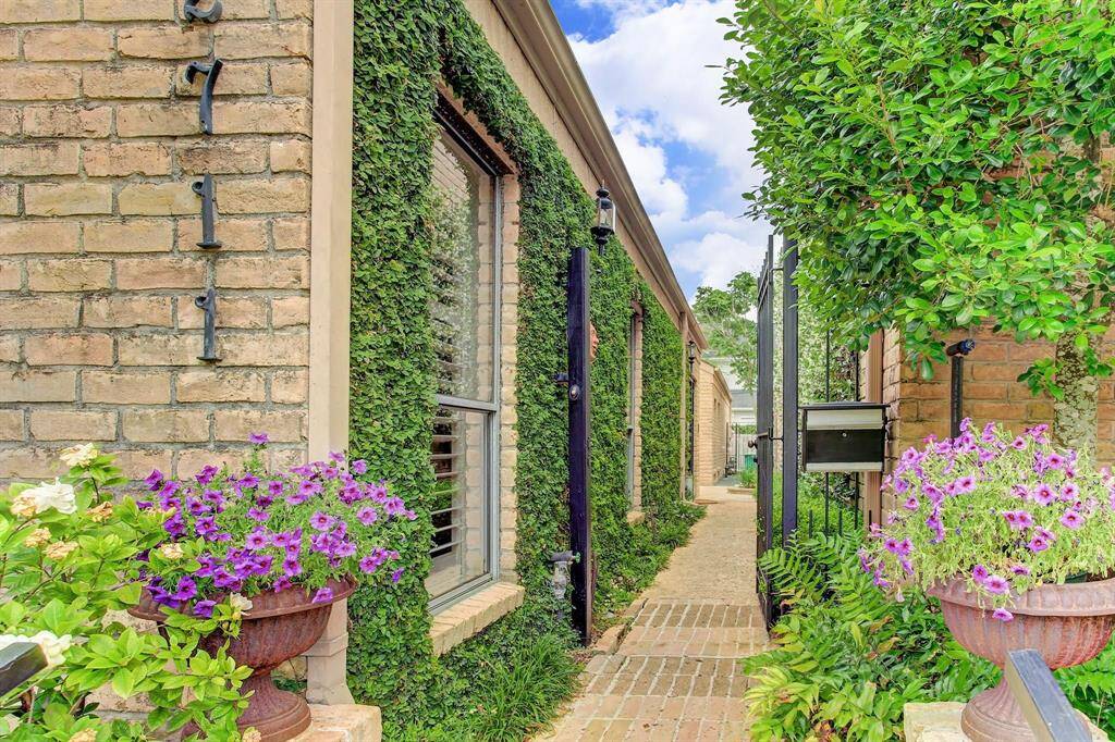 Home is free-standing and features gated private walkway to entrance.
