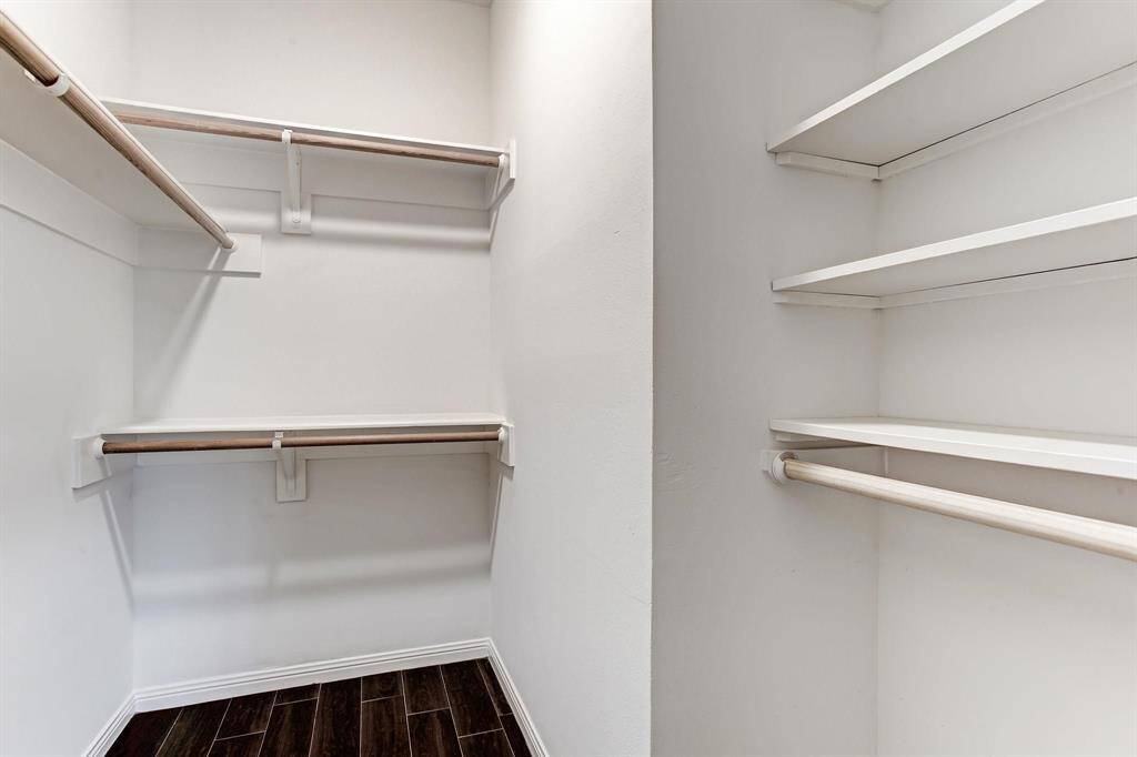 Large walk-in closet for secondary bedroom.