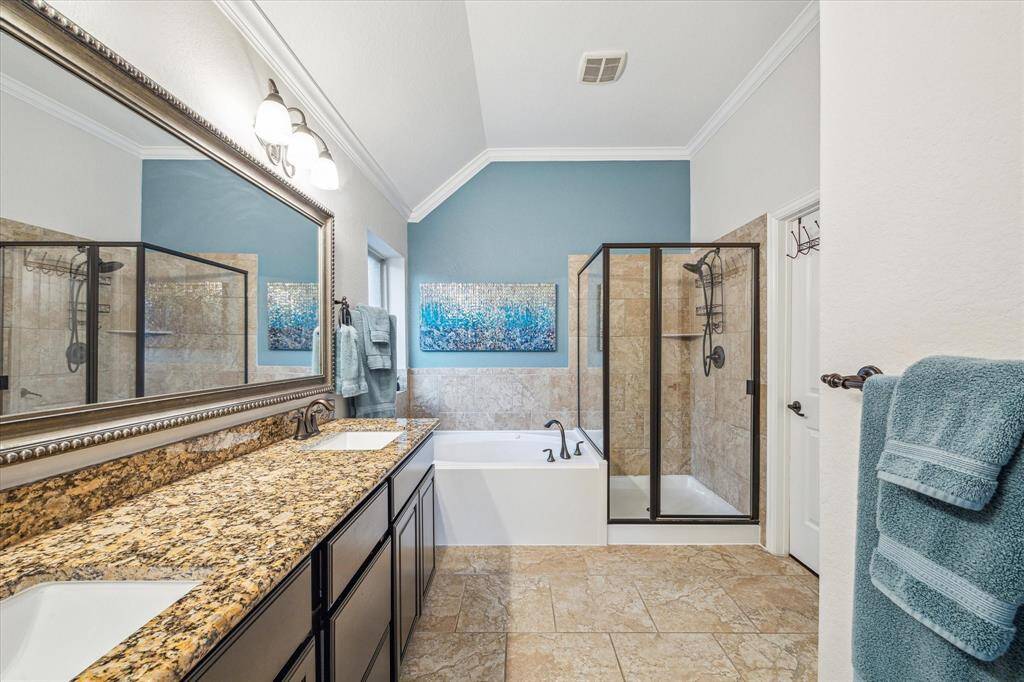 Primary bathroom with large tub and separate shower