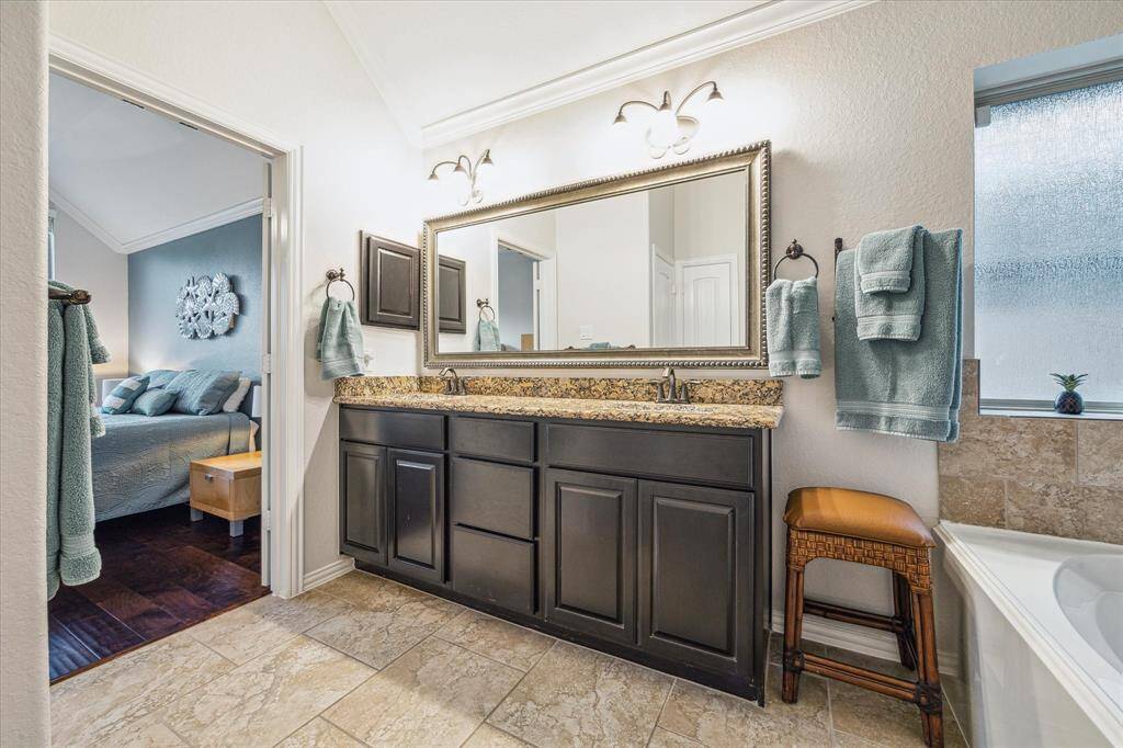 Primary bathroom with double sinks and huge walk in closet