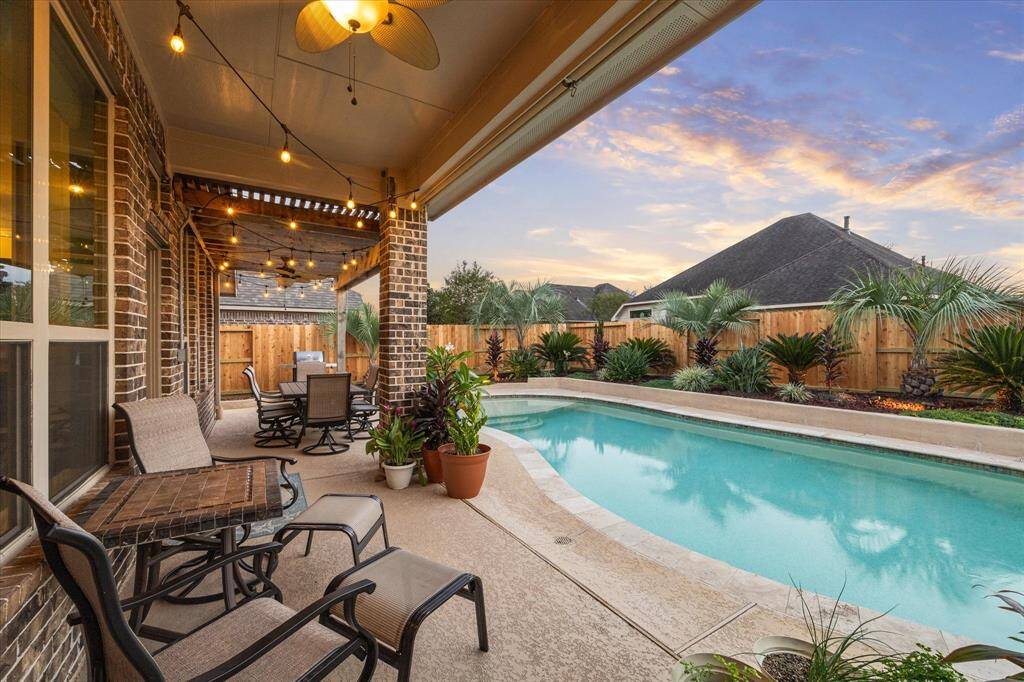 Full back patio UV roller shades that you can lower and raise as needed