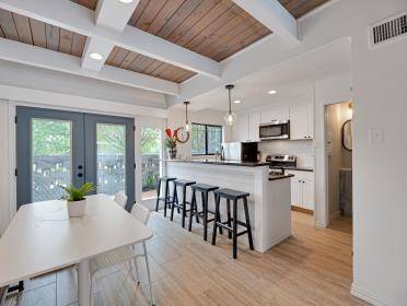 What a wonderful open space for dining and cooking with additional bar stool seating.