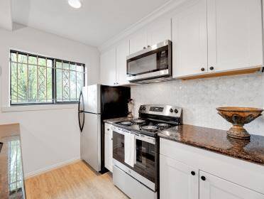 Stainless steel appliances and granite counters.