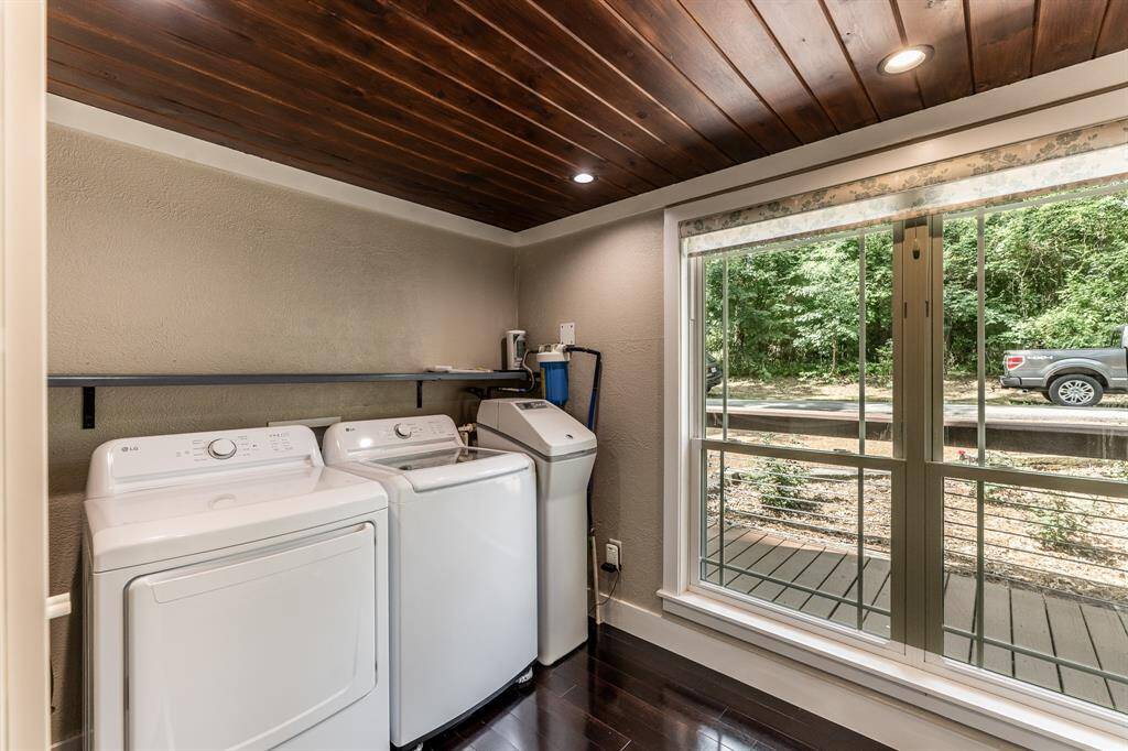 Laundry room features matching LG washer and dryer which will remain.  It also features a GE 40,000 grain water softener and a whole house Aqua Pure water filter.