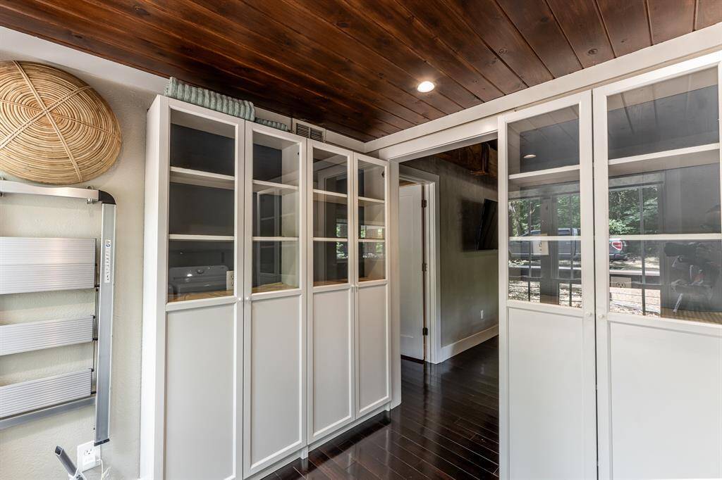 Laundry room also has built in cabinets for additional storage.  Note: light switch for laundry room is located inside one of the cabinets.