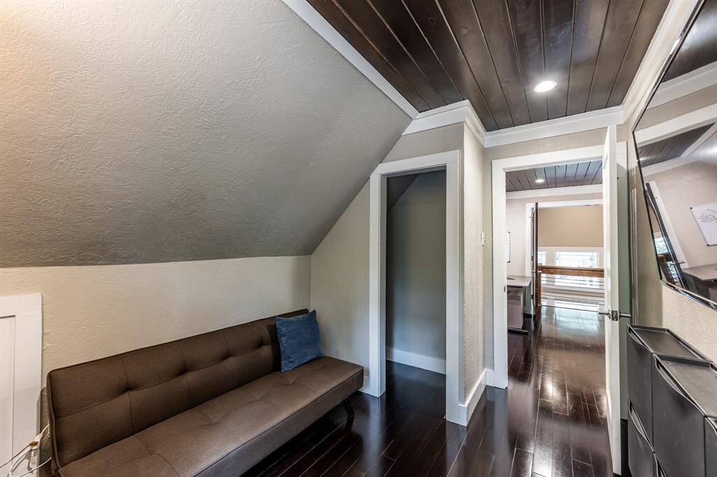 The upstairs bedroom is the perfect size for a twin bed and dresser, or as you see here, a fold out futon and tv.  The TV will remain.