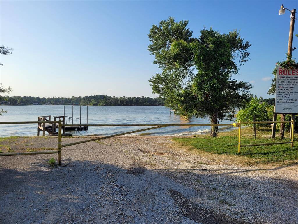 The community boat ramp features a locking gate, a floating boat dock, and a community swimming area.
