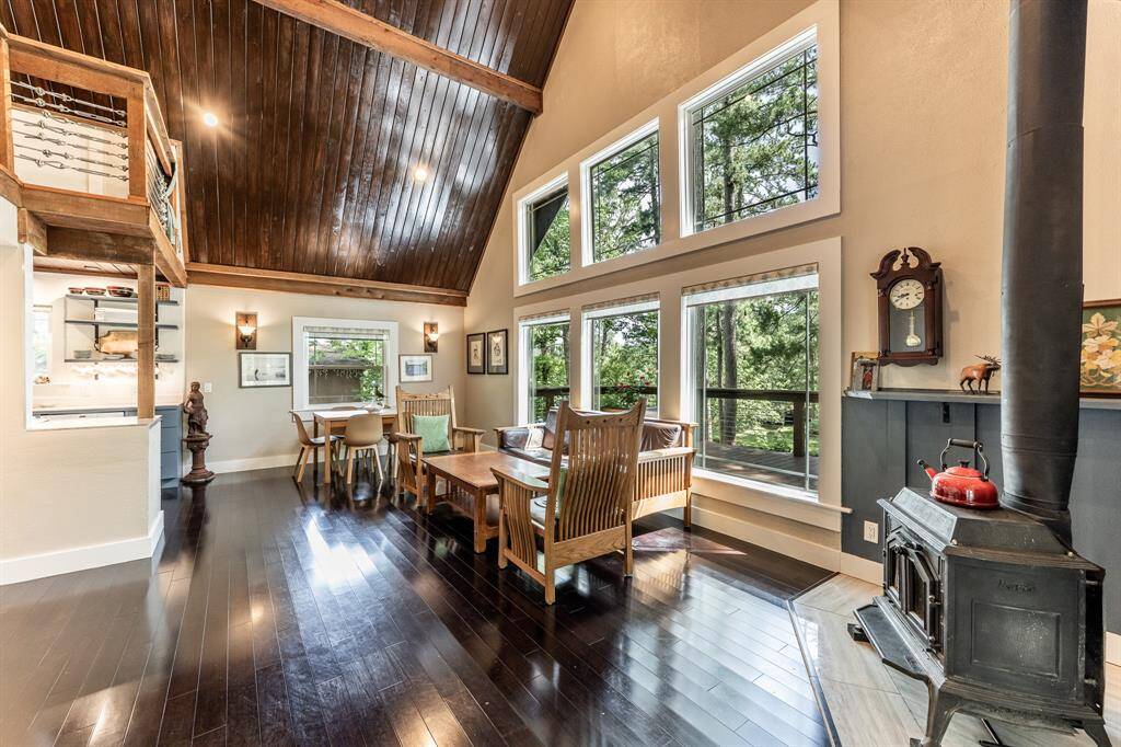 Once in the living room, you will see the open concept first floor.  You will go from the living room to the dining room, then to the kitchen.  Also notice the soaring ceilings in the living room.