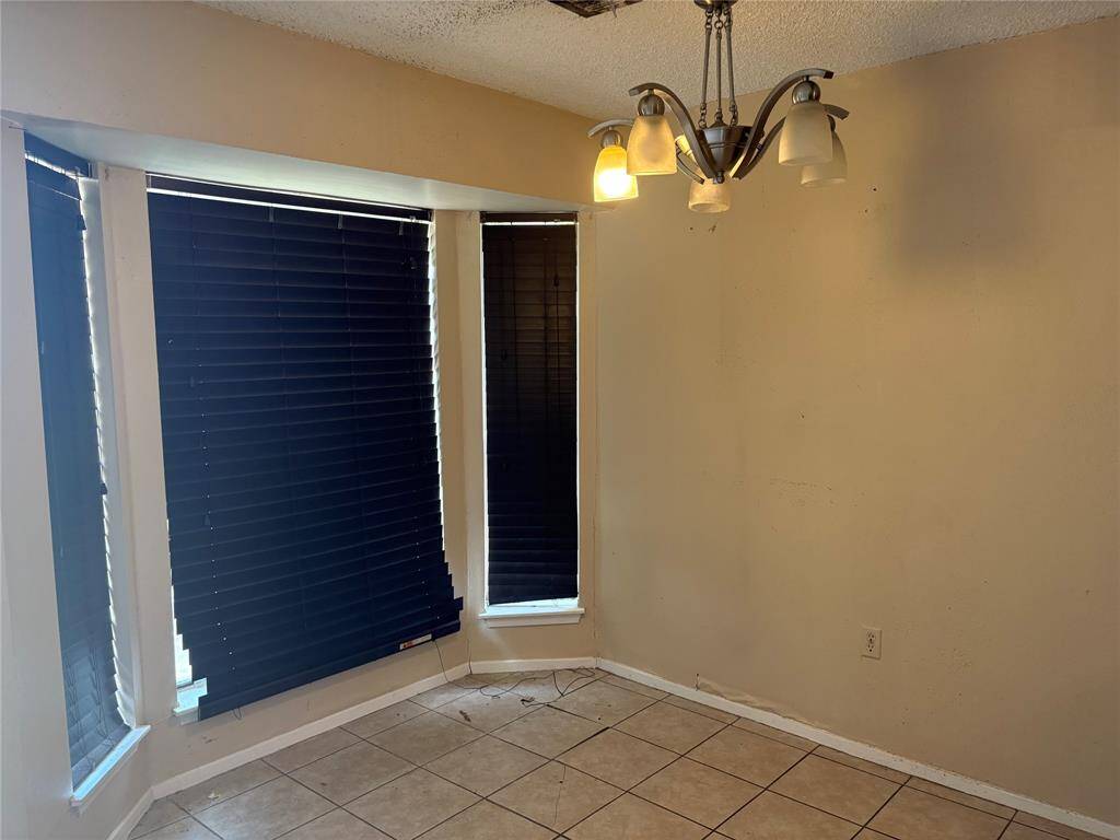 Dining area with tile flooring