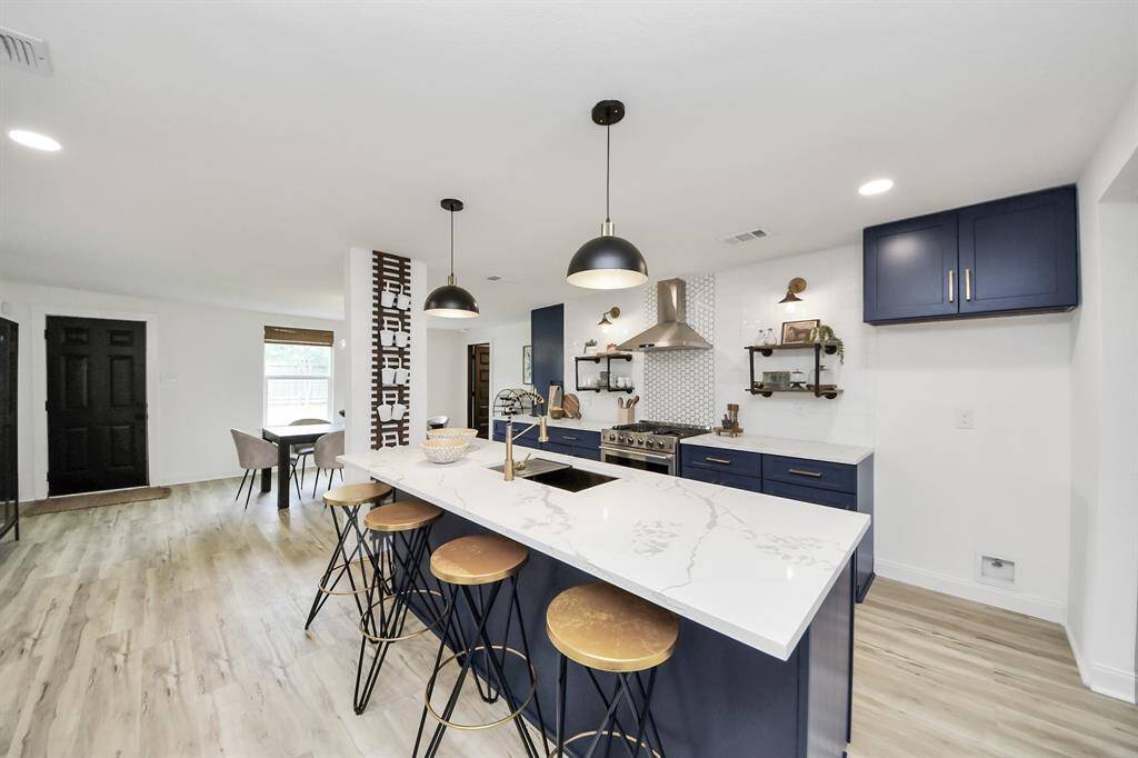 The kitchen, an integral part of thishome's open-concept design,seamlessly flows off the living room,creating a harmonious andconnected living space.