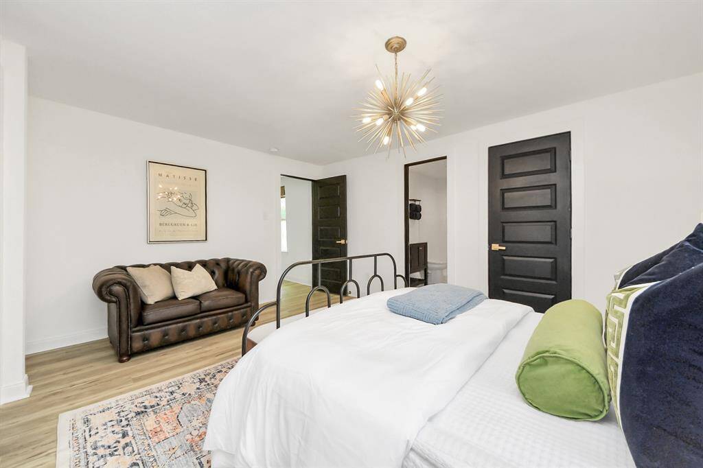 The primary bedroom has a chandelier and en-suite bathroom.