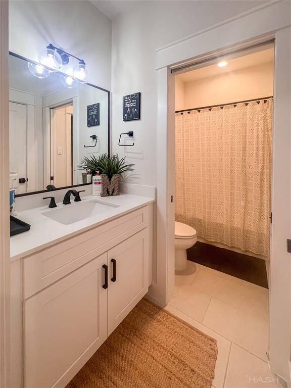 Sink with pocket door leading to bathtub. huge linen closet located directly across from the sink.