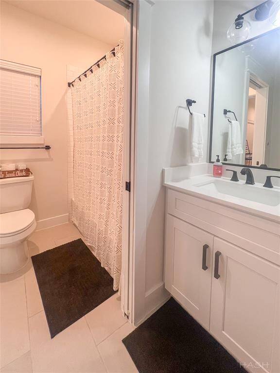 Other side of the Jack and Jill bathroom separated by pocket doors. 2nd room of four not pictured as it’s being used for storage.