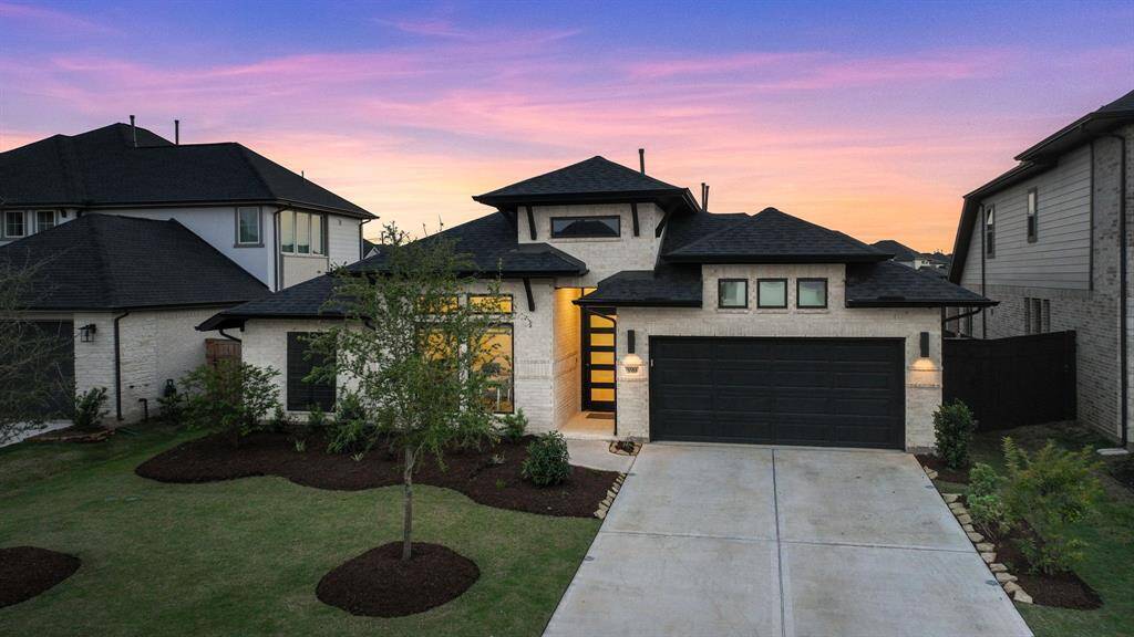 Gorgeous front elevation w/pristine landscape