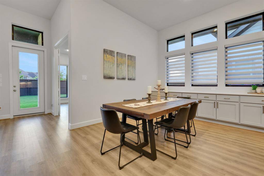 The dining area will accommodate a large 8 person table!