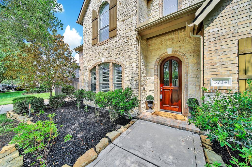 Brick and stone combine to create a stunning exterior that welcomes guests.