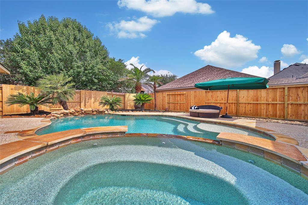 You'll love relaxing in your own backyard oasis, complete with a refreshing saltwater pool and soothing spa—perfect for unwinding any time.