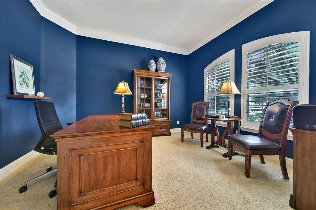 The ideal spot to conduct business or just keep your family organized. Stately Shutters accent the space.